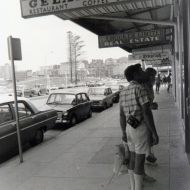 Tourists_looking_at_the_cake_window_of_the_Gelato_Bar_1973.jpg