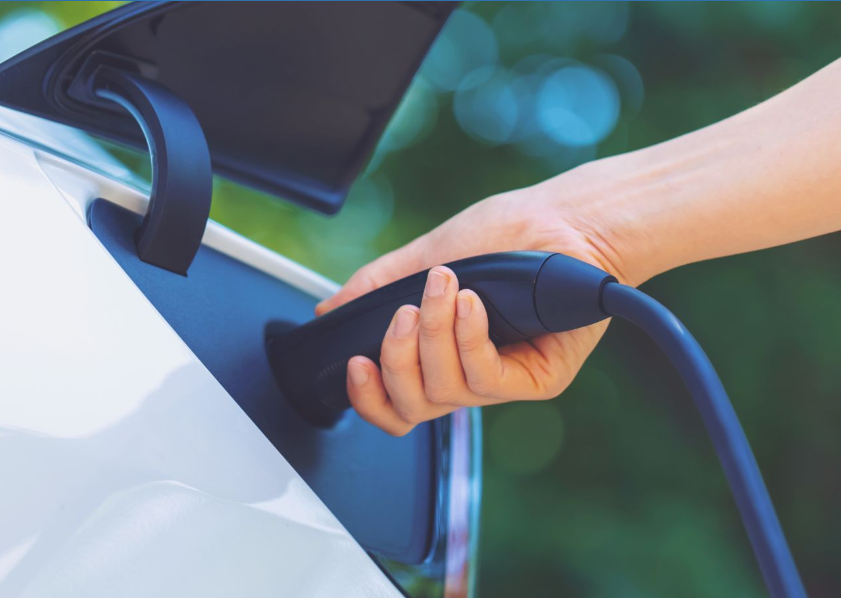 A person charging their electric vehicle