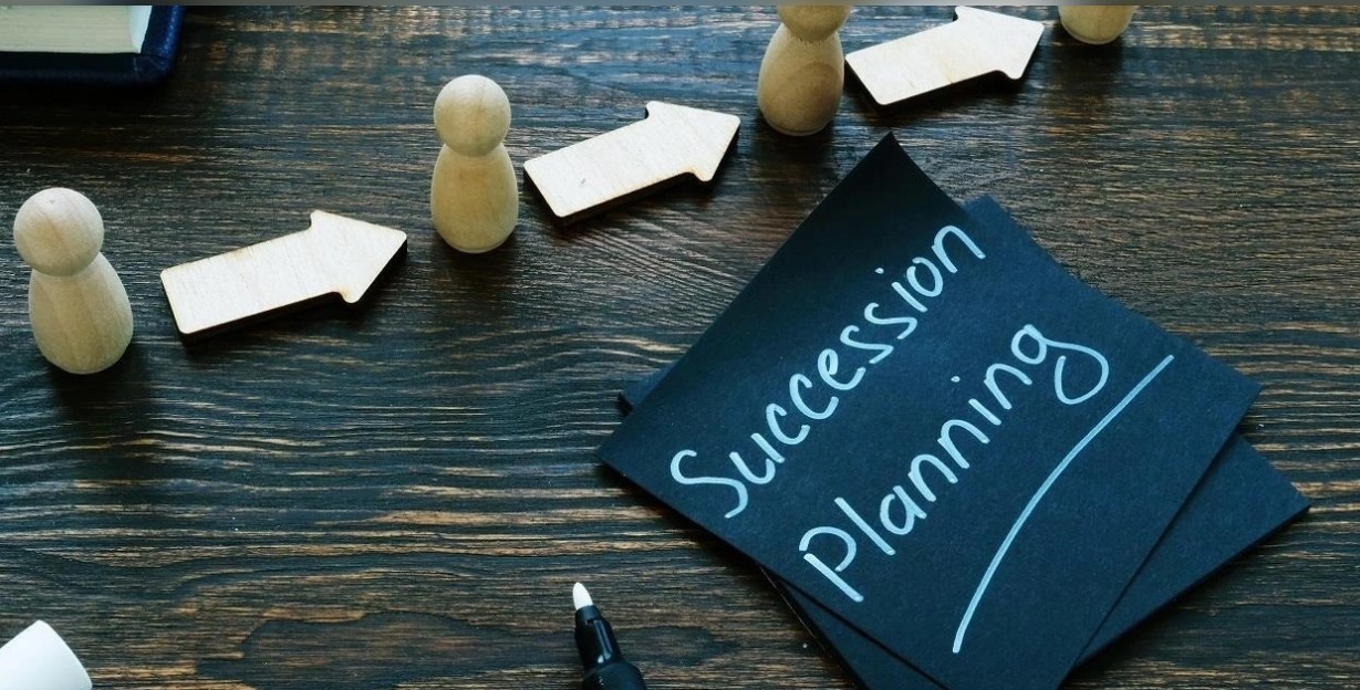 Scene of a desk with succession planning documents