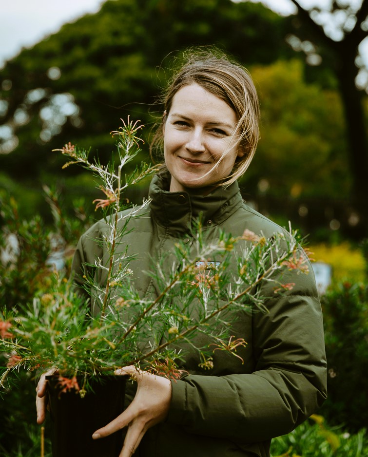 Lady holding native plant