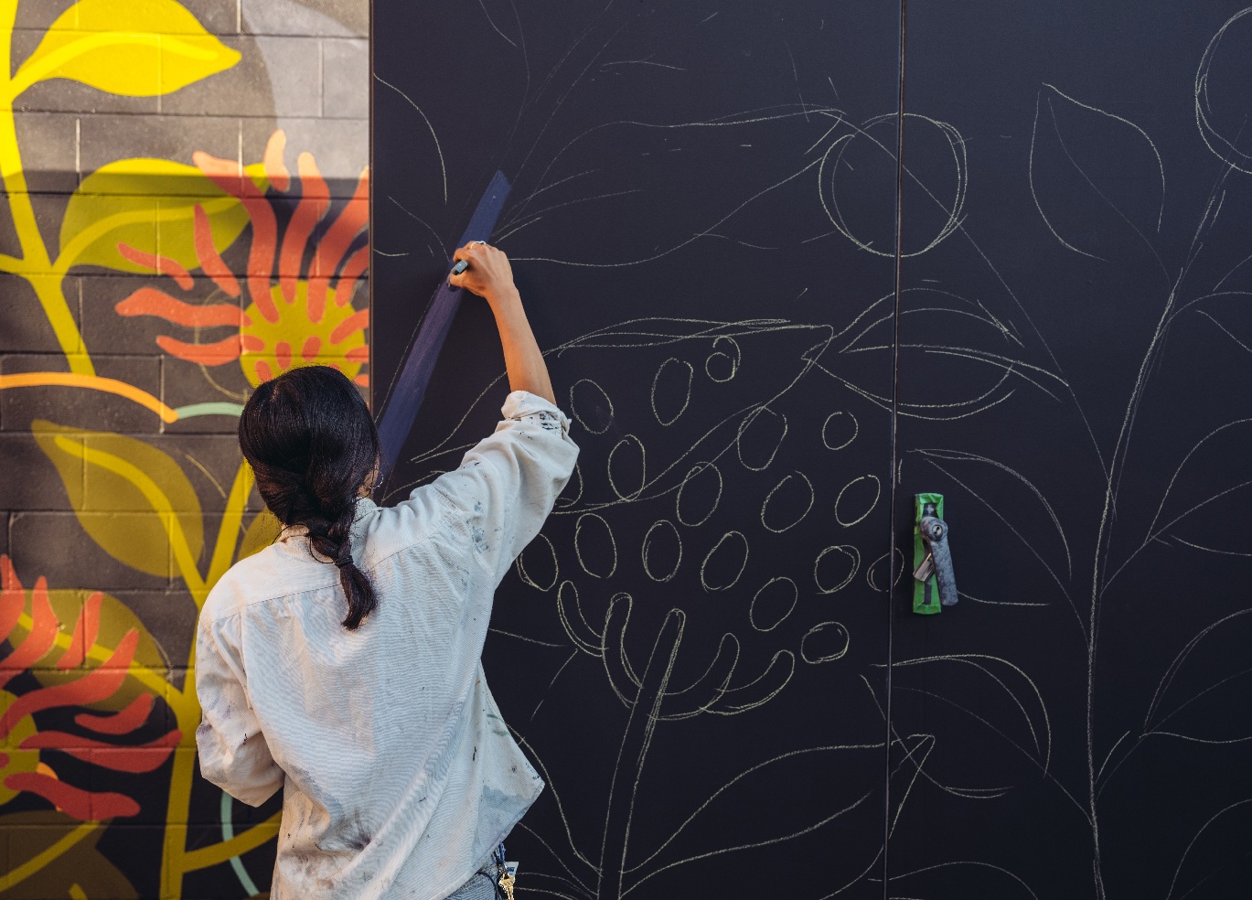 artist paints mural