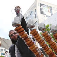 Lighting_my_doughnut_Menorah_Courtesy_J_Wire.jpg