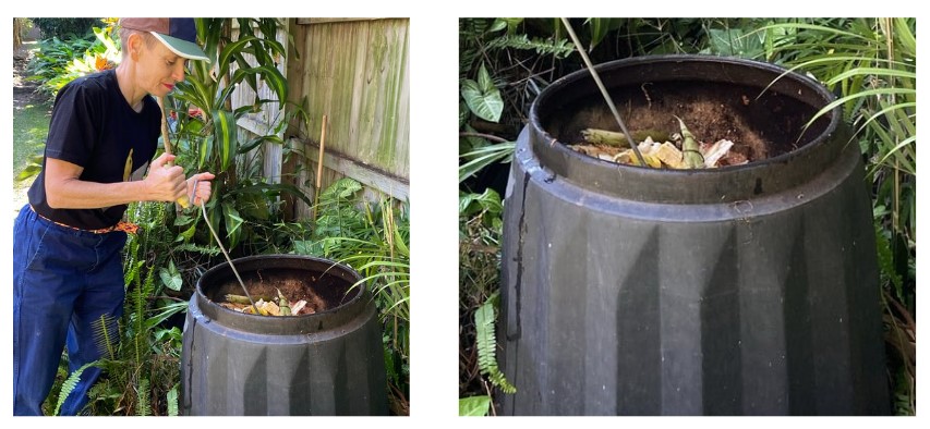 Belinda mixing her compost into compost bin