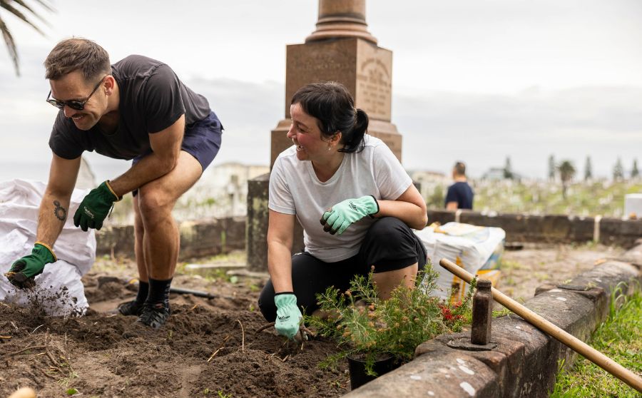 Two people participating in corporate volunteering program at Waverley Cemetery